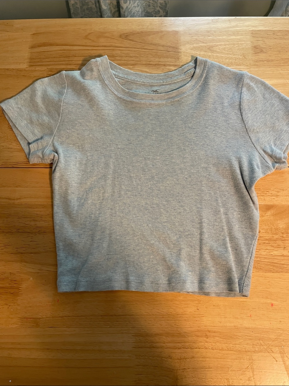 Hollister woman’s light blue heathered baby crew T